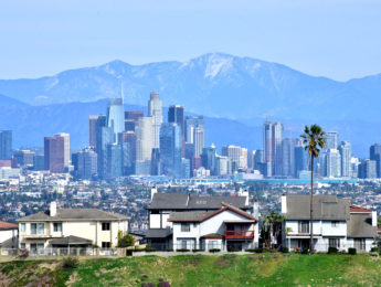 LA city skyline with homes in foreground