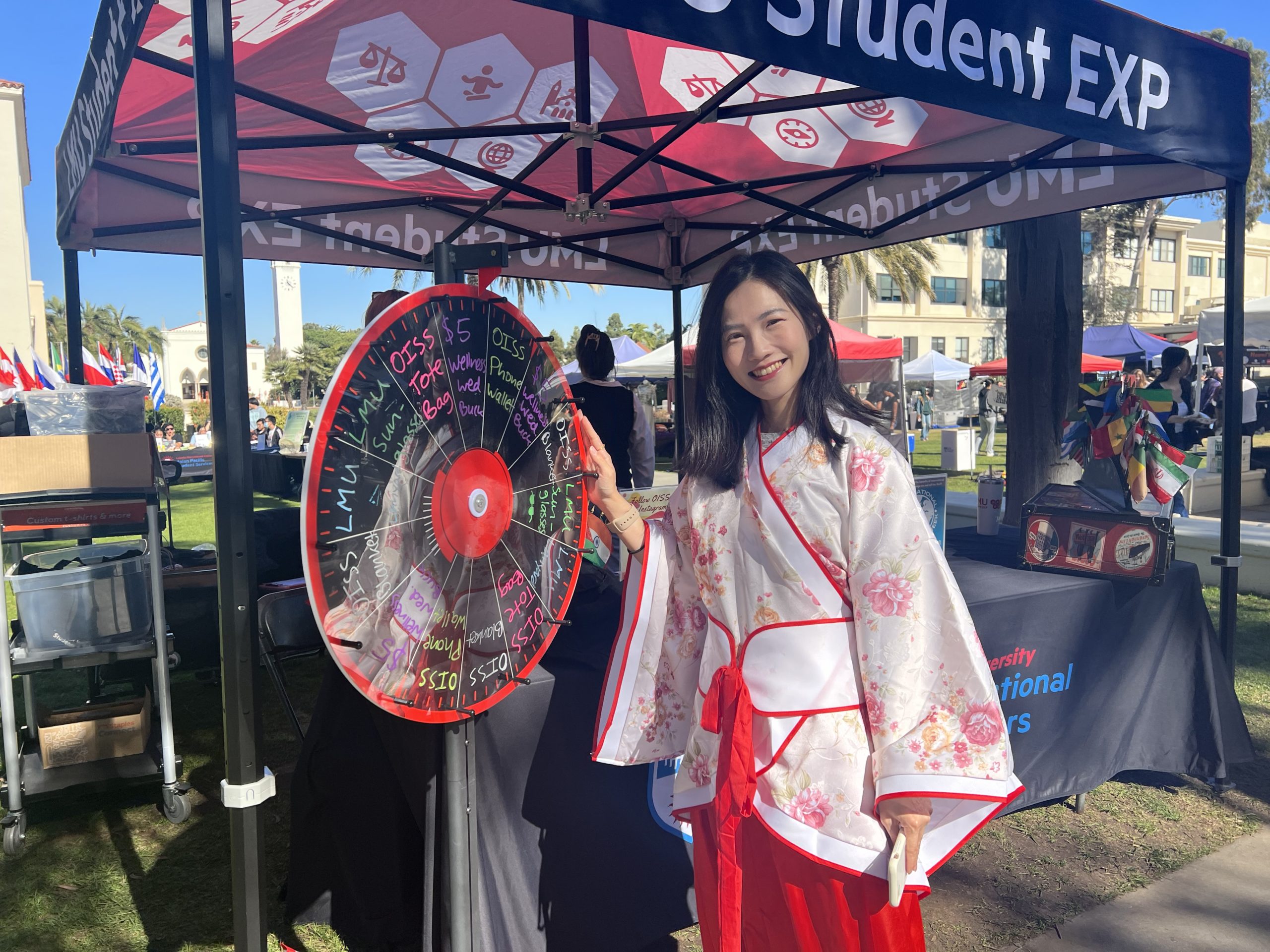 Yi-Hua Shih stands in a traditional outfit outside during the International Education Fair.