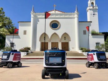 Kiwibot in front of LMU's Sacred Heart Chapel