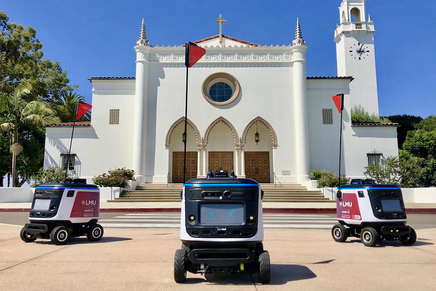 Kiwibot in front of LMU's Sacred Heart Chapel
