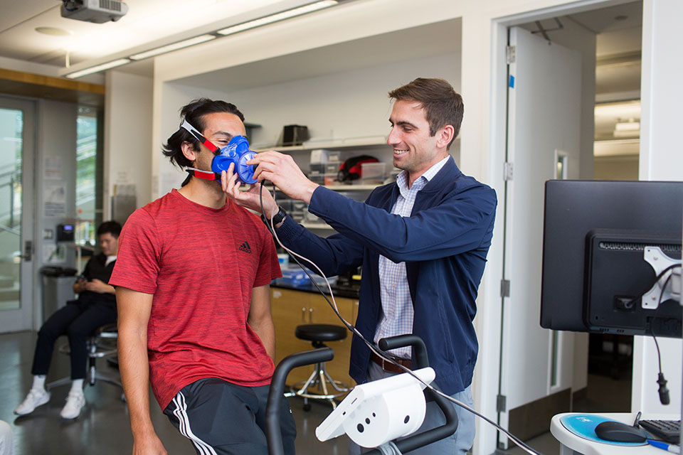 Prof. Rob Musci works with a student during his Exercise Physiology lab.