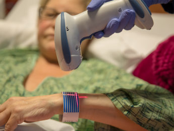 Image of a hospital wristband being scanned