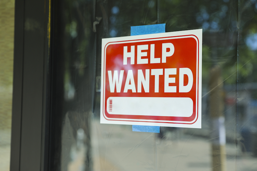Help Wanted sign in store window