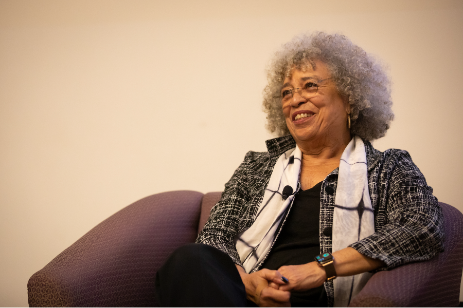 A close up photo of Angela Davis seated in the Life Science Building auditorium.