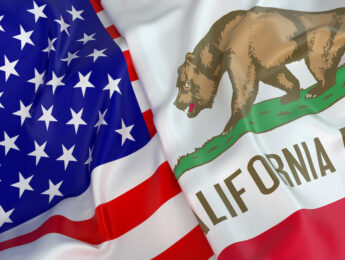 Close-up of USA flag with flag of California