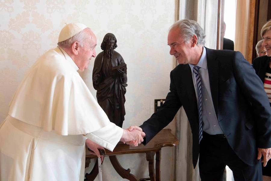 Dell'Oro shaking hands with Pope Francis