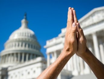 Image of praying hands in Washington D.C.