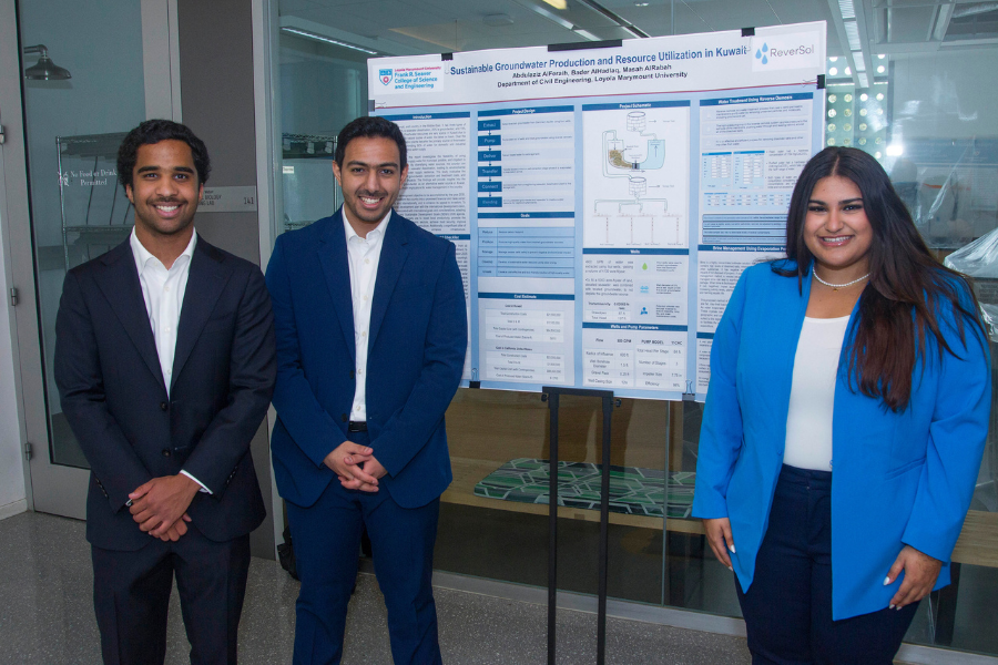 Three students smile, standing next to the poster board for their project, titled 'Sustainable Groundwater Production and Resource Utilization in Kuwait'