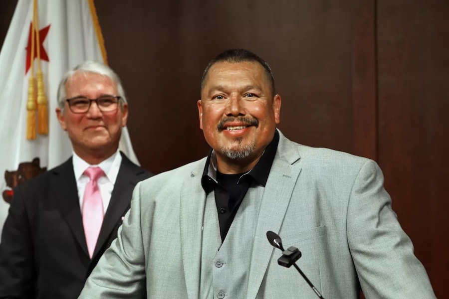 Daniel Saldana smiles as Dist. Atty. George Gascón, left, looks on after Thursday’s announcement that Saldana, who was wrongly convicted of attempted murder of six people in 1990, was free after 33 years behind bars.Credit: Carolyn Cole/Los Angeles Times