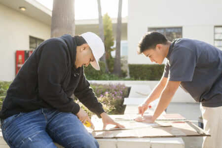 Two LMU's GeoWall team members work on their project.