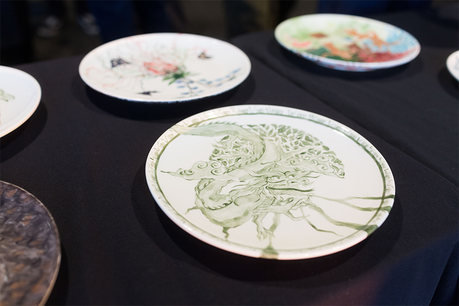 A white plate with green art