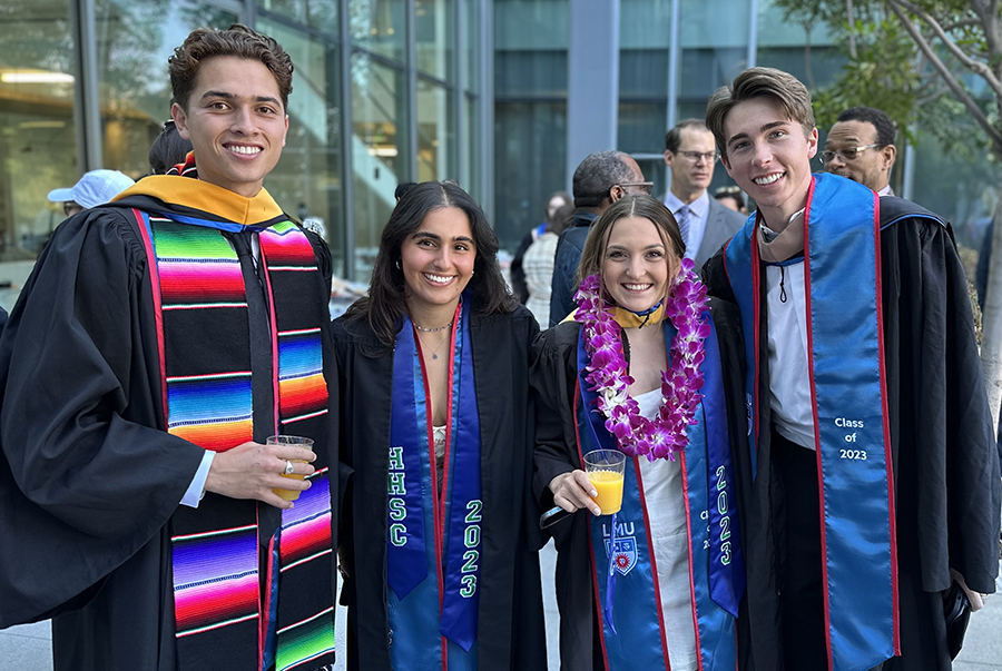 Four HHSC graduates pose for a photo