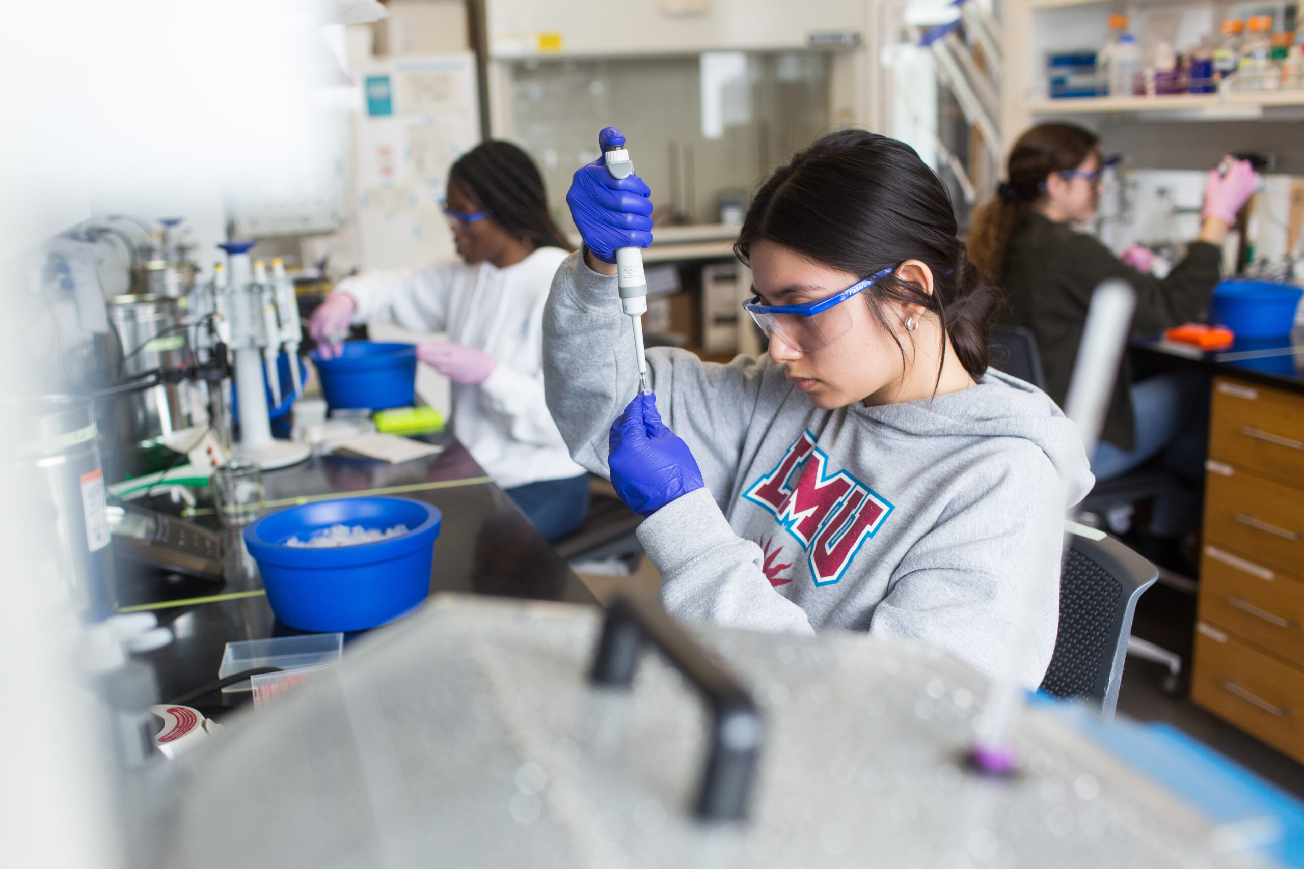 LMU students conduct biochemistry research under Professor Mouzakis.