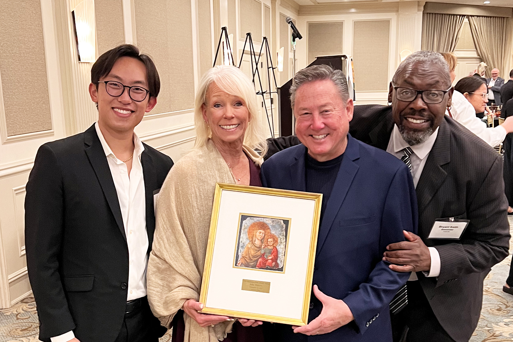 Pictured left to right: Jeremy Lee, assistant director of choral activities, John's wife Kathleen, John Flaherty, and Bryant Keith Alexander, CFA dean