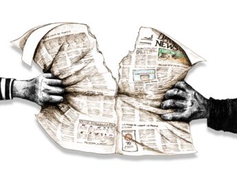 hands tearing newspaper apart (graphic)