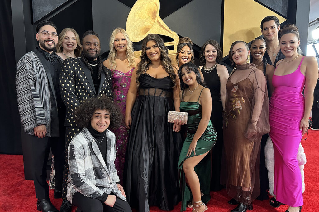 A music group poses at the Grammys