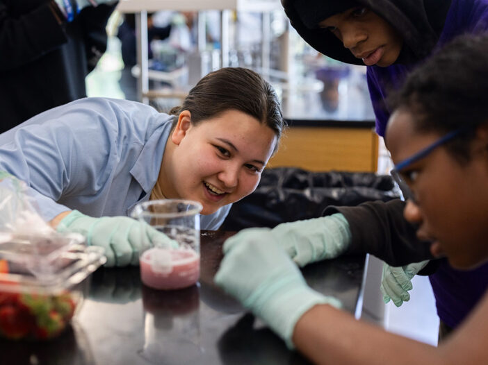LMU student leads younger students in science activity
